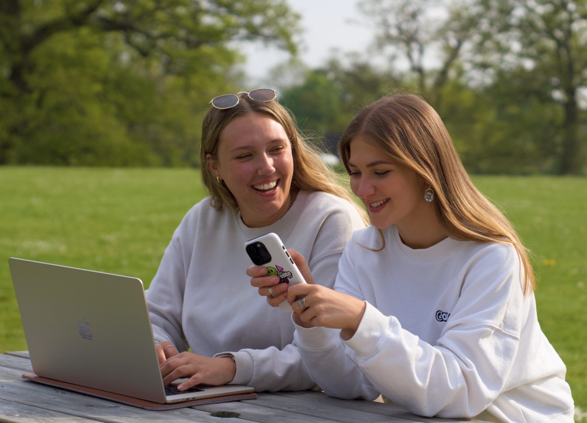 Compelite Pro team reviewing Instagram content outdoors in Bristol